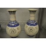 A pair of Chinese blue and white reticulated lantern vases.