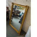 A decorative gilt framed mirror.