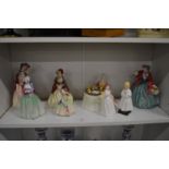 A collection of Royal Doulton figurines.