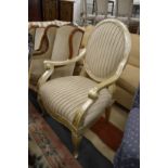 A large French style open armchair with silvered frame.