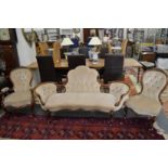 A very good Victorian carved walnut three-piece salon suite comprising a settee, armchair and side