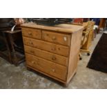 A pine chest of drawers.