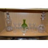 Two cut-glass decanters and other glassware.