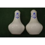 A pair of Queen's Club salt shakers.