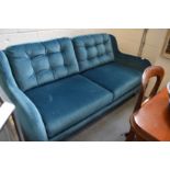 A good modern large teal upholstered two-seater settee.