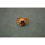 An 18ct gold and ruby ring.