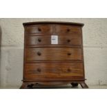 A miniature chest of drawers.