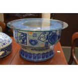 A large Japanese Arita blue and white porcelain Hibachi (jardiniere) with later glass top.