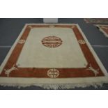 A modern Chinese carpet, beige ground with a decorative border 9ft 8ins x 7ft 9ins.