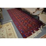 A good Persian Bokhara style hall carpet.