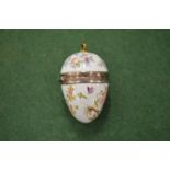 A small enamel egg shaped pomander.