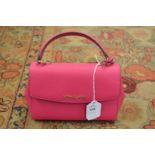 A Michael Kors cerise leather small handbag.