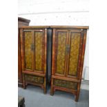 A good pair of highly decorative Chinese gilt decorated lacquer two door cabinets, each with a