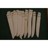 A collection of carved ivory letter openers.