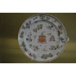 A Famille Rose circular armorial warming dish.