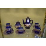 A blue glass and gilt decorated part tea service.