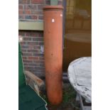 A large terracotta chimney pot 4ft 10ins high.