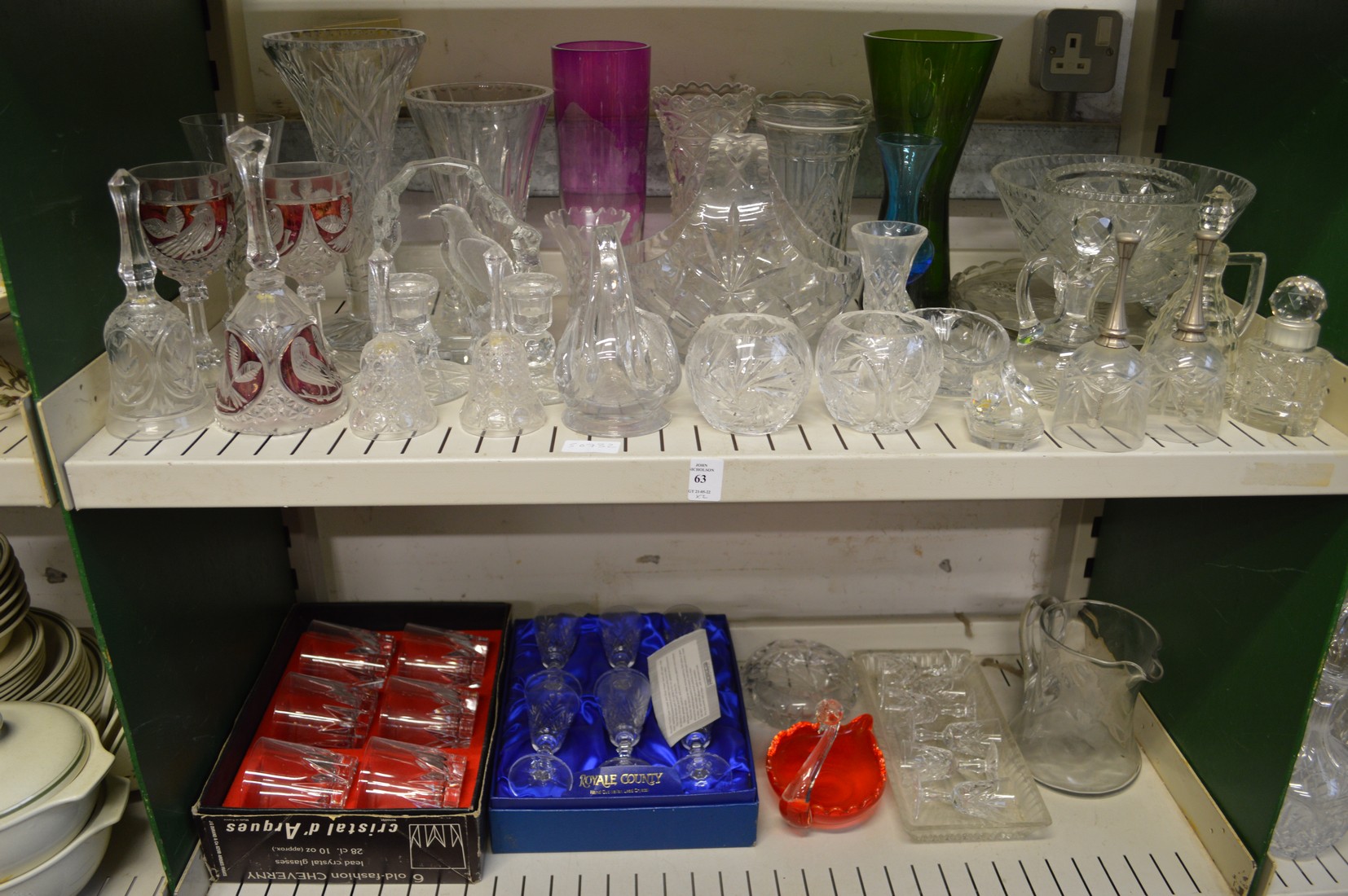 Two shelves of cut-glassware.