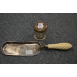 A silver lidded cut-glass jar and a plated crumb scoop.