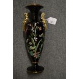An enamel decorated twin handled vase.