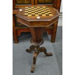 A Victorian walnut octagonal shaped games / work table.