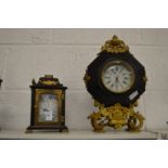 Two decorative mantle clocks.