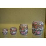 A graduated set of four Canton porcelain jars and covers.