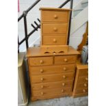 A modern pine chest of drawers and matching three drawer chest.