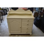 A cream painted bedroom chest.