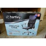 An office swivel armchair, boxed.