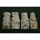 A set of four ivory netsukes.