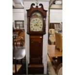 A 19th century oak and mahogany cased longcase clock with painted arched dial.