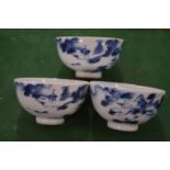 A set of three Chinese blue and white tea bowls.