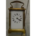 A brass carriage clock.