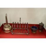 A silver toast rack and other items.