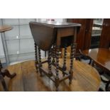 A small oak drop-leaf gate-leg table.