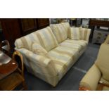A good Duresta large two-seater settee upholstered in a beige striped material.