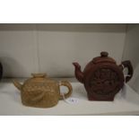 Two Chinese Yixing pottery teapots.
