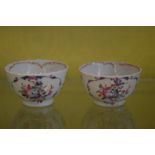 A pair of Famille Rose tea bowls.