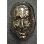 Wayne D Filan (American, born 1946) two highly unusual silvered opaque glass sculptures of faces,