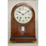 A 19th century mahogany cased arched top mantle clock.