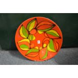 A good large Poole Pottery Delphis charger, orange ground with stylized decoration, shape no. 54,