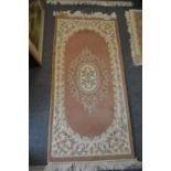 Two small Chinese rugs.
