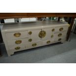 A painted Chinese low cupboard / chest unit.