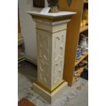 A classical style painted wood pedestal.