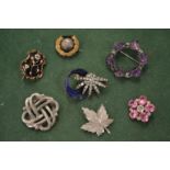 Various brooches.