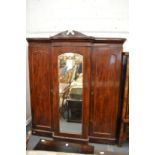 A Victorian mahogany breakfront three-door wardrobe.