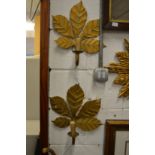 A pair of leaf shaped wall sconces.