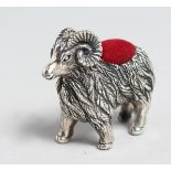 A SILVER RAM PIN CUSHION.