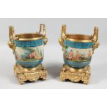 A GOOD PAIR OF SEVERS DESIGN PORCELAIN AND GILT METAL CACHE POTS painted with cymbals. 7.5ins